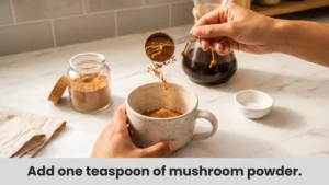 Adding mushroom powder to mug for easy mushroom coffee preparation