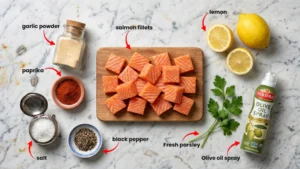 Fresh salmon fillet with olive oil, honey, paprika, and spices for air fryer salmon bites recipe.