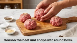 Four raw ground beef balls seasoned and ready for smash burger patty melt recipe
