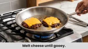 American cheese melting on smash burger patties for patty melt recipe